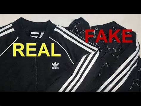 fake adidas hoodie vs real|real adidas jackets.